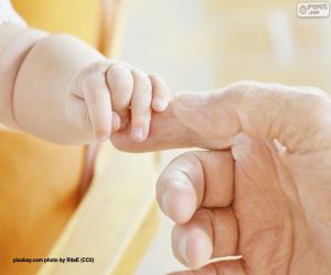 yapboz Babasının parmağını toplayan bebek